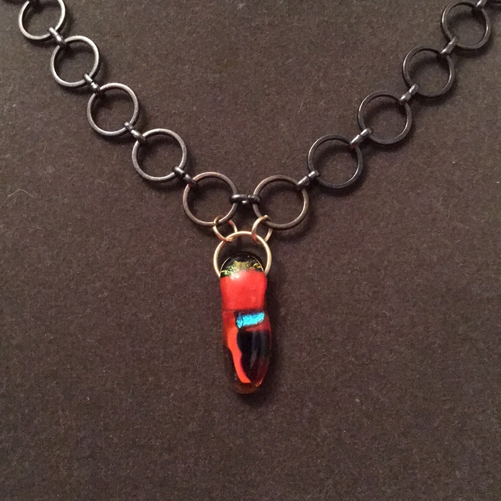Glass pendant on black chain
